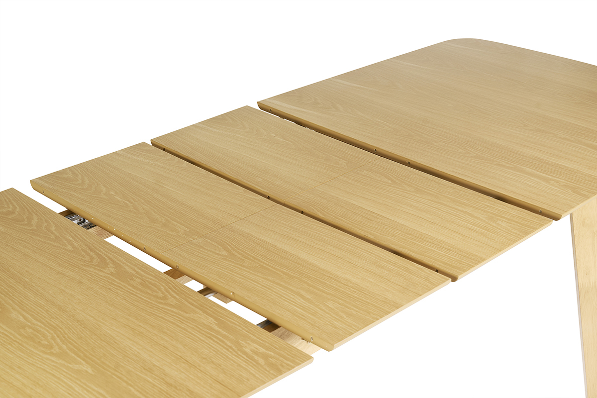 Table � manger extensible en bois clair avec rallonges visibles, vue de dessus.