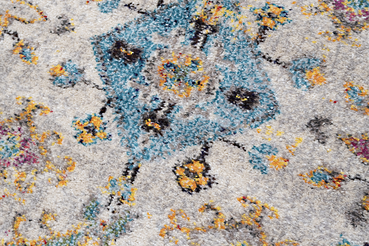 Gros plan sur motif multicolore du tapis rectangulaire DULCE.